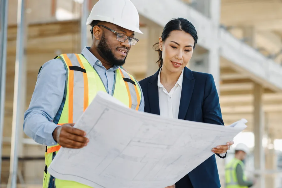 Engineering and construction staffing professionals reviewing plans